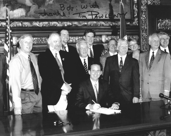 Photo of Tim Pawlenty signing bill