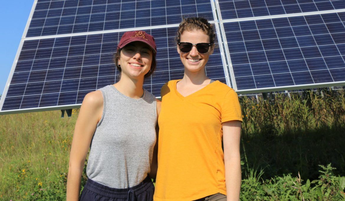 People vising solar array.