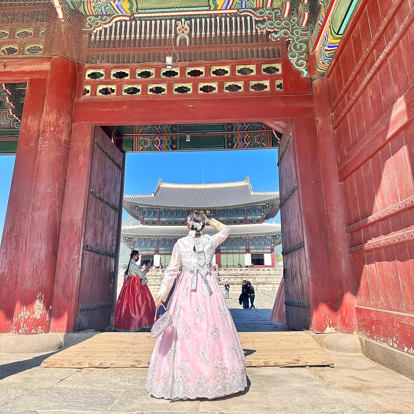 Annie posing in front of a temple in Korea