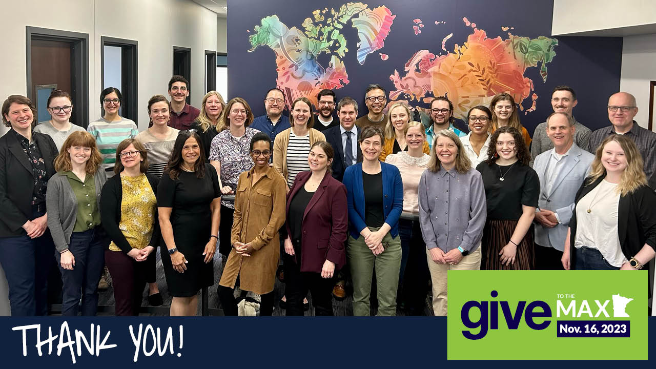 Fresh Energy Staff posed in front of a mural in the Saint Paul office. Text: Thank you! Give to the Max Day logo. 
