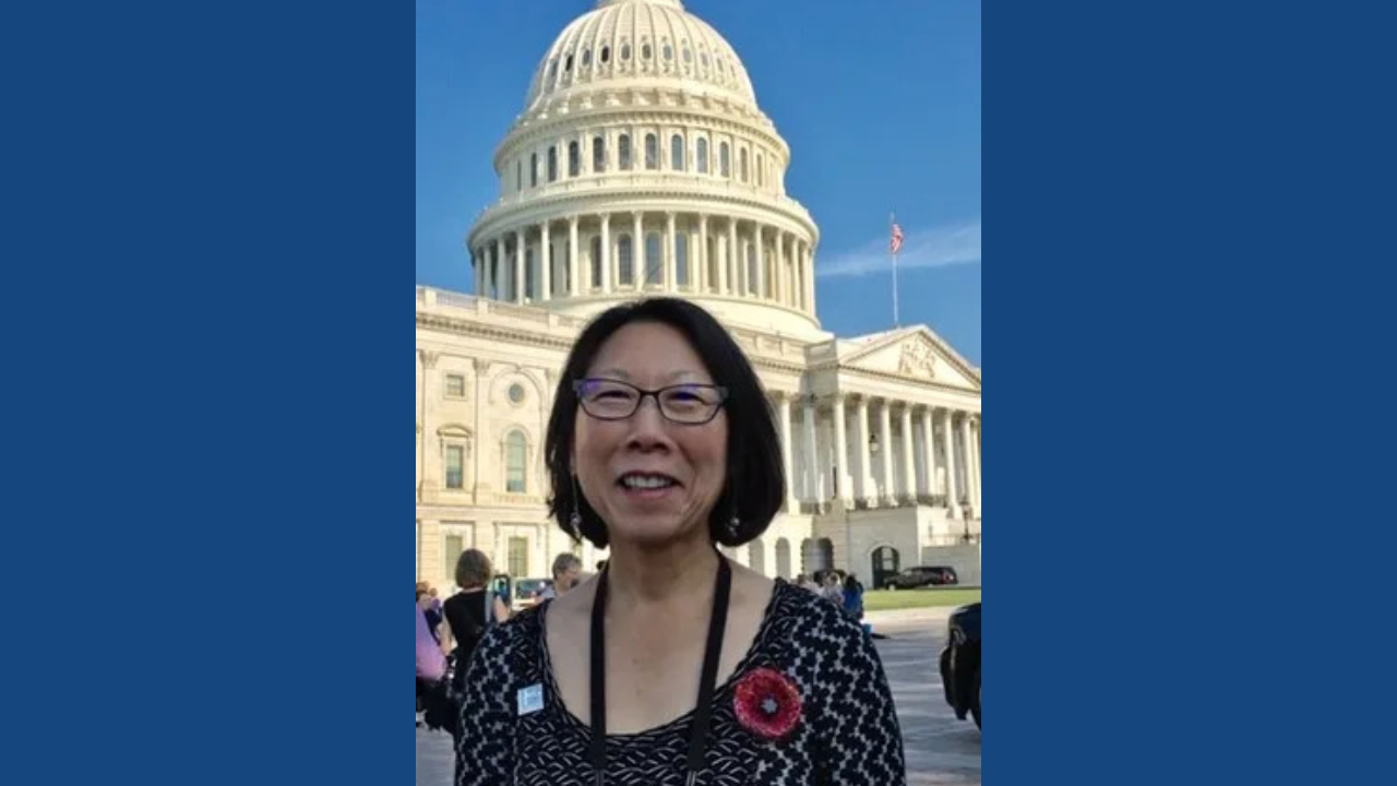 Susie smiling in front of Capitol Building 